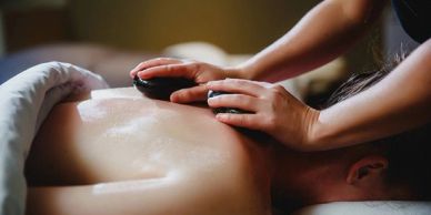 Hot Stone Massage at Aura Thai Spa in Las Vegas for deep relaxation and muscle recovery.

