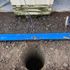 Augured hole for basketball goal base