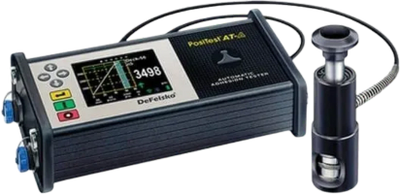 Portable ultrasonic thickness gauge with digital display and probe.