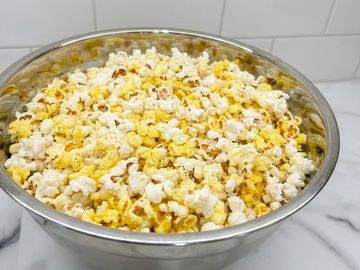 Large bowl filled with popcorn.