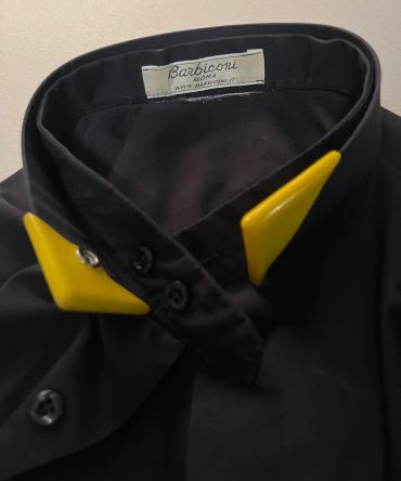 Black shirt with a yellow collar clip.