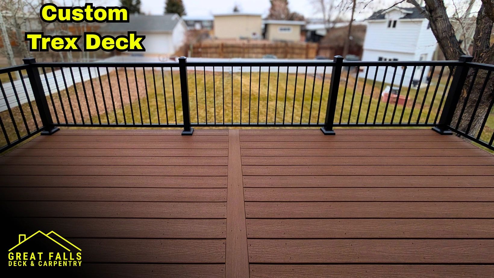 Backyard composite deck with black railing in Great Falls, MT