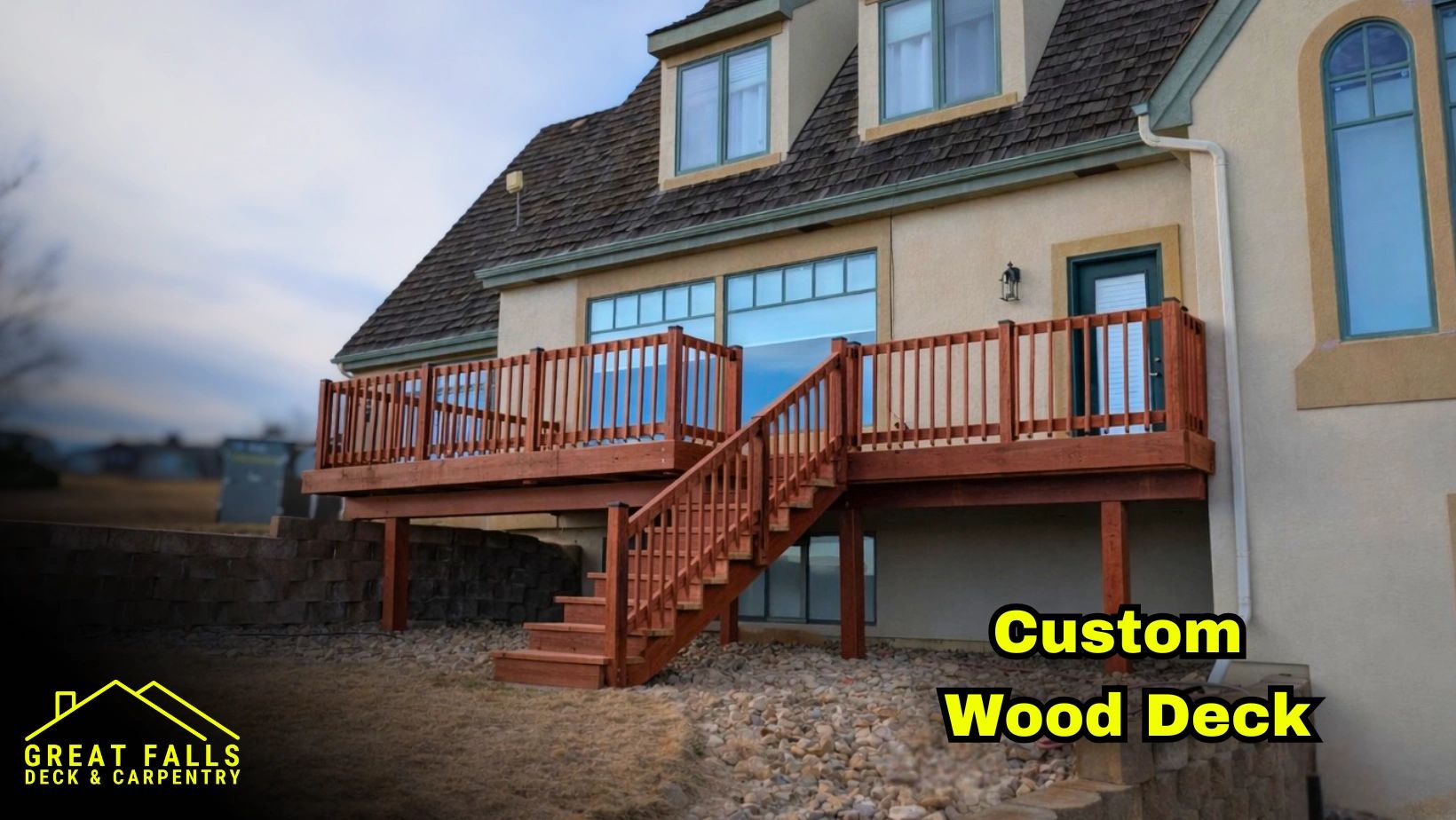 Elevated wood deck with stairs and railing overlooking Great Falls, MT