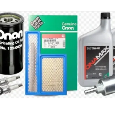 Onan engine maintenance kit with oil filter, spark plugs, air filters, oil, and fuel filter.