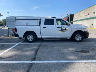 Police pickup truck parked in a lot.