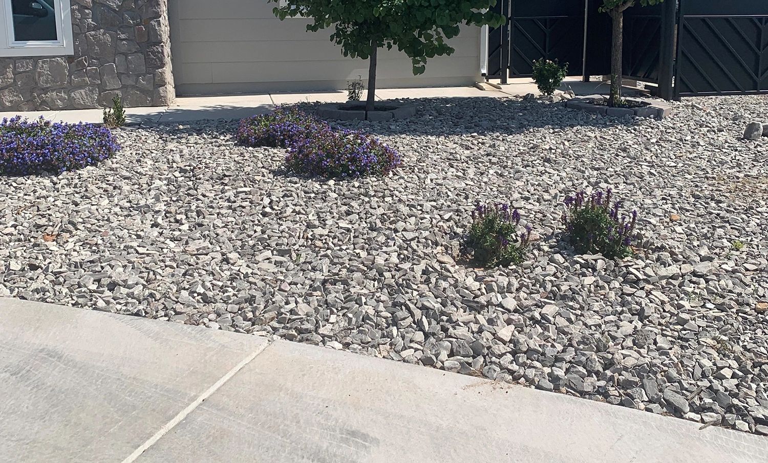 1" crushed gravel in a front yard.