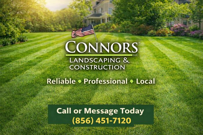 Construction worker with a yellow helmet standing beside a ladder inside a wooden structure.
