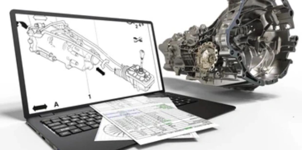 Laptop displaying technical automotive diagrams with a transmission component and documents.