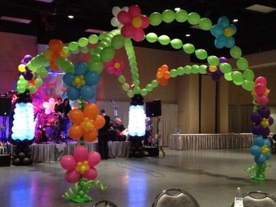 1960's themed dance floor, lava lamp balloon sculpture, colorful balloon daisies.