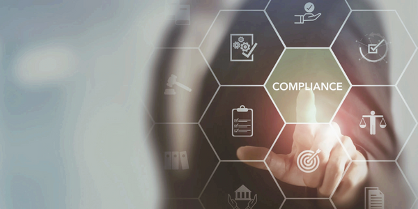 Person pointing at a virtual interface with the word 'COMPLIANCE' highlighted.