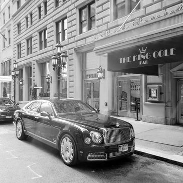 New York City Luxury Rolls Royce parked outside The King Cole Bar adjacent to the St. Regis Hotel on