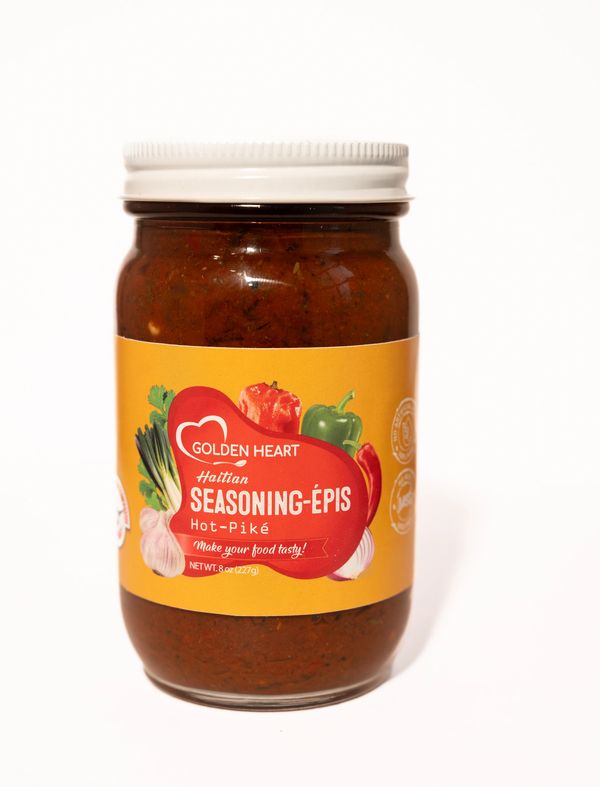 Jar of Taïna Haitian Epis Spicy wet seasoning paste, clear view of colorful herbs and spices