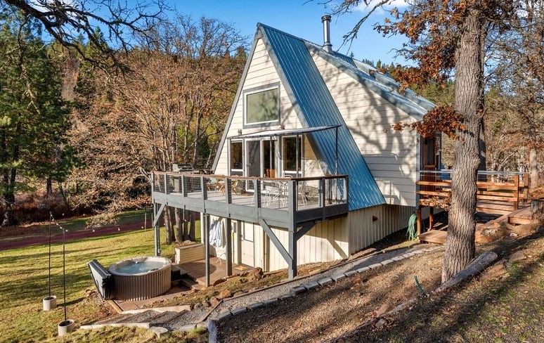 Cozy riverfront chalet on 10 private acres near Goldendale, WA with two decks, fire pits, vaulted kn