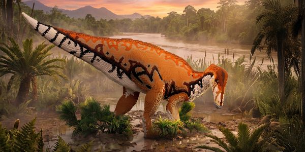 A dinosaur with orange and black patterns near a river in a prehistoric forest.