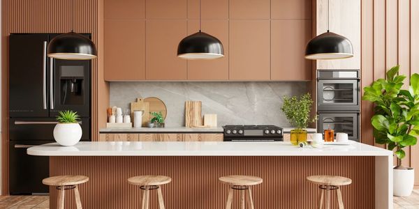 Modern kitchen with wood accents, marble backsplash and built-in appliances