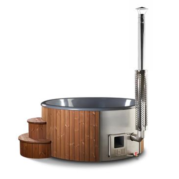 Wooden hot tub with metal chimney and stairs.