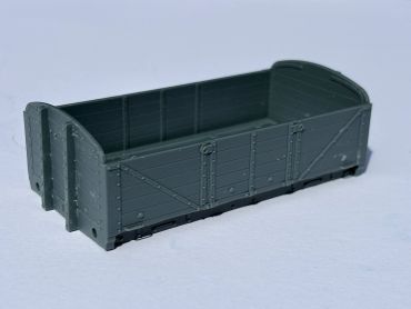 Model of a gray open cargo railcar.