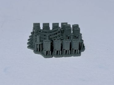 Miniature army plastic figures in rows.