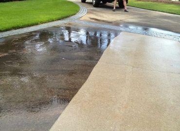 Driveway pressure washing in Monmouth County — oil stains and built-up grime eliminated.