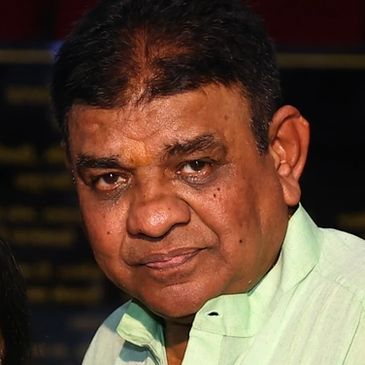 Portrait of a middle-aged man with a serious expression.