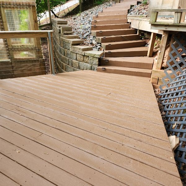 Wooden stairs and floating deck resurfaced for a crack-free and non-slip surface.