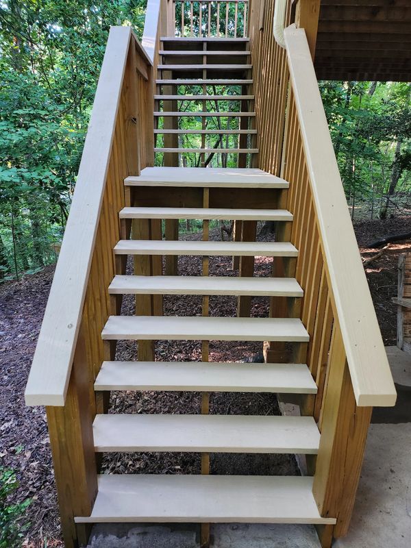 Deck stairs coated for a non-slip surface.