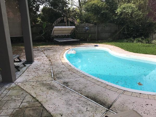 Before image of a concrete pool deck.