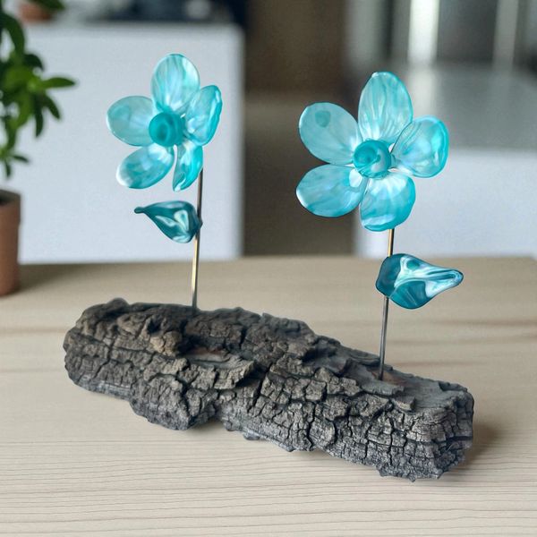 Double Teal glass flower on wood