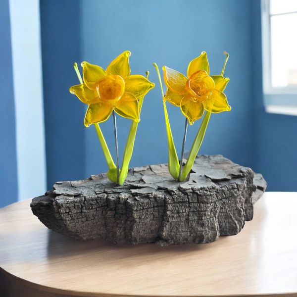 Lampwork yellow daffodil flowers on driftwood