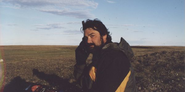Talking on Satellite phone about 20 miles south of Deadhorse, Alaska on AGPPT pipeline job 7/2001