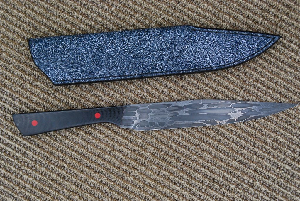 Large Ball Bearing Canister Damascus, Black G10 handle with Red pins and liners.