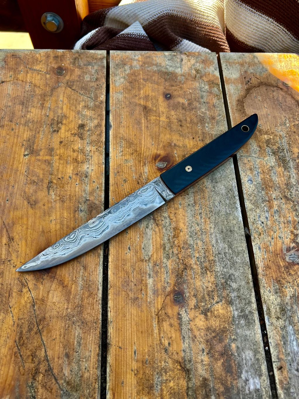 Tamahagane and Old W2 Tanto Style Blade. Black G10, Red Liners and, Mosaic pin/ Brass Lanyard tube. 