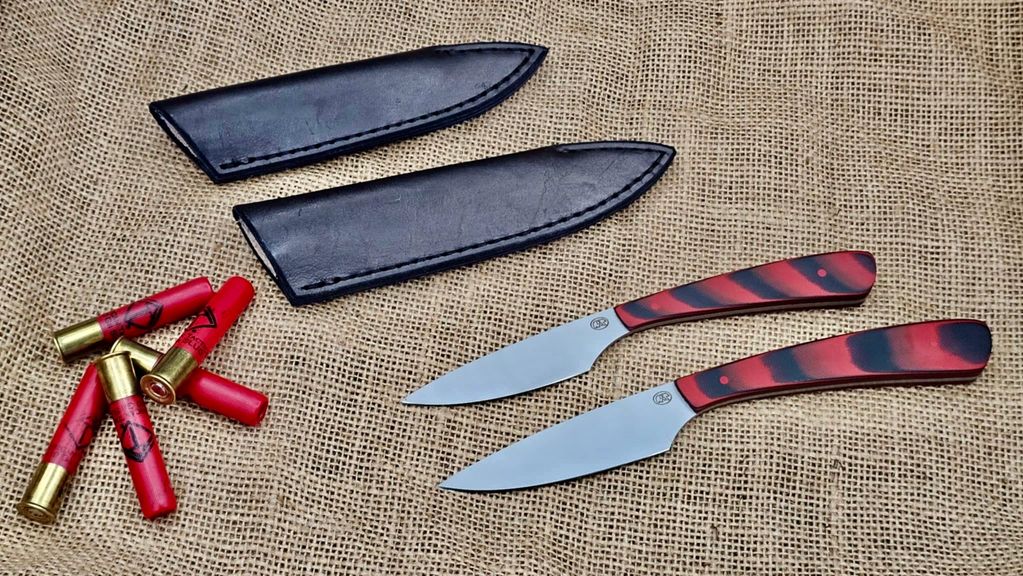 Both sizes of our classic Bird and Trout Knives.  Cherry Red and Black G10 scales on AEB-L SS.