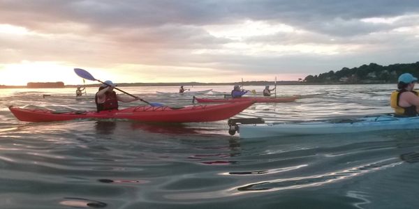 sunset kayaking waves