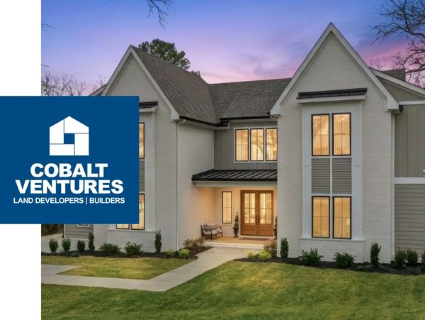 Modern two-story house with large windows at dusk and Cobalt Ventures logo.