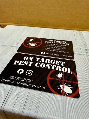 Business cards for On Target Pest Control with contact info and services.