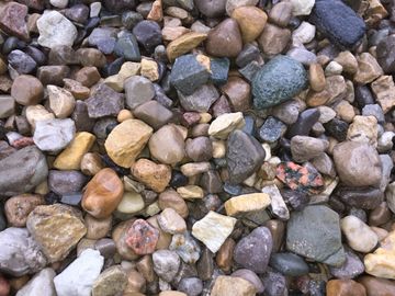 These are very colorful river pebbles. The stones are a small and smooth mixture.