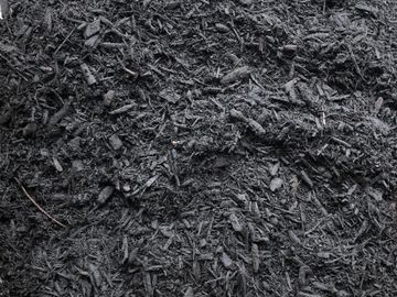 This is black colored mulch. All natural hardwood that has been ground and colored to a rich black.