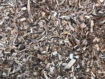 Ground wood material is a soft playground chip. It is a light weight, light colored natural product.