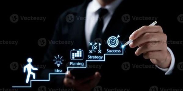 Businessman illustrating steps from idea to success using digital icons.