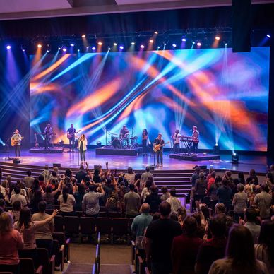 Church stage with a band, lights and a large high resolution LED video display as a backdrop. 