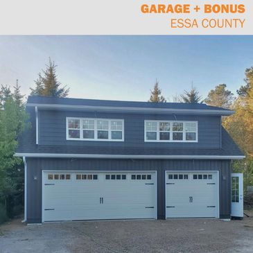Modern two-story garage with bonus space above.