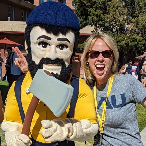 Erin Stanford with Louie the Lumberjack mascot.