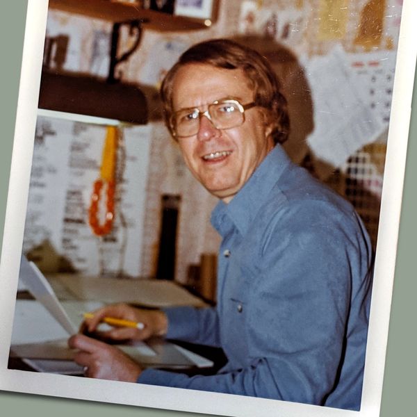 Earl Engelmann, working at his drawing table.