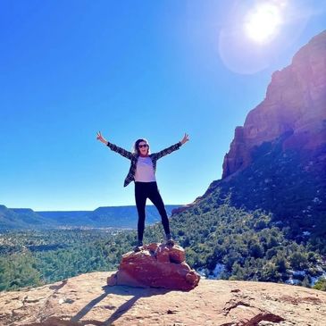 woman in the top of a canyon