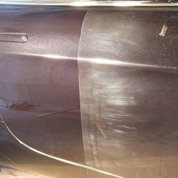 A car door showing a polished side and scratched side