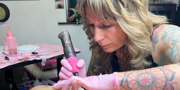 Experienced artist tattooing realistic nipples on a post mastectomy customer. 