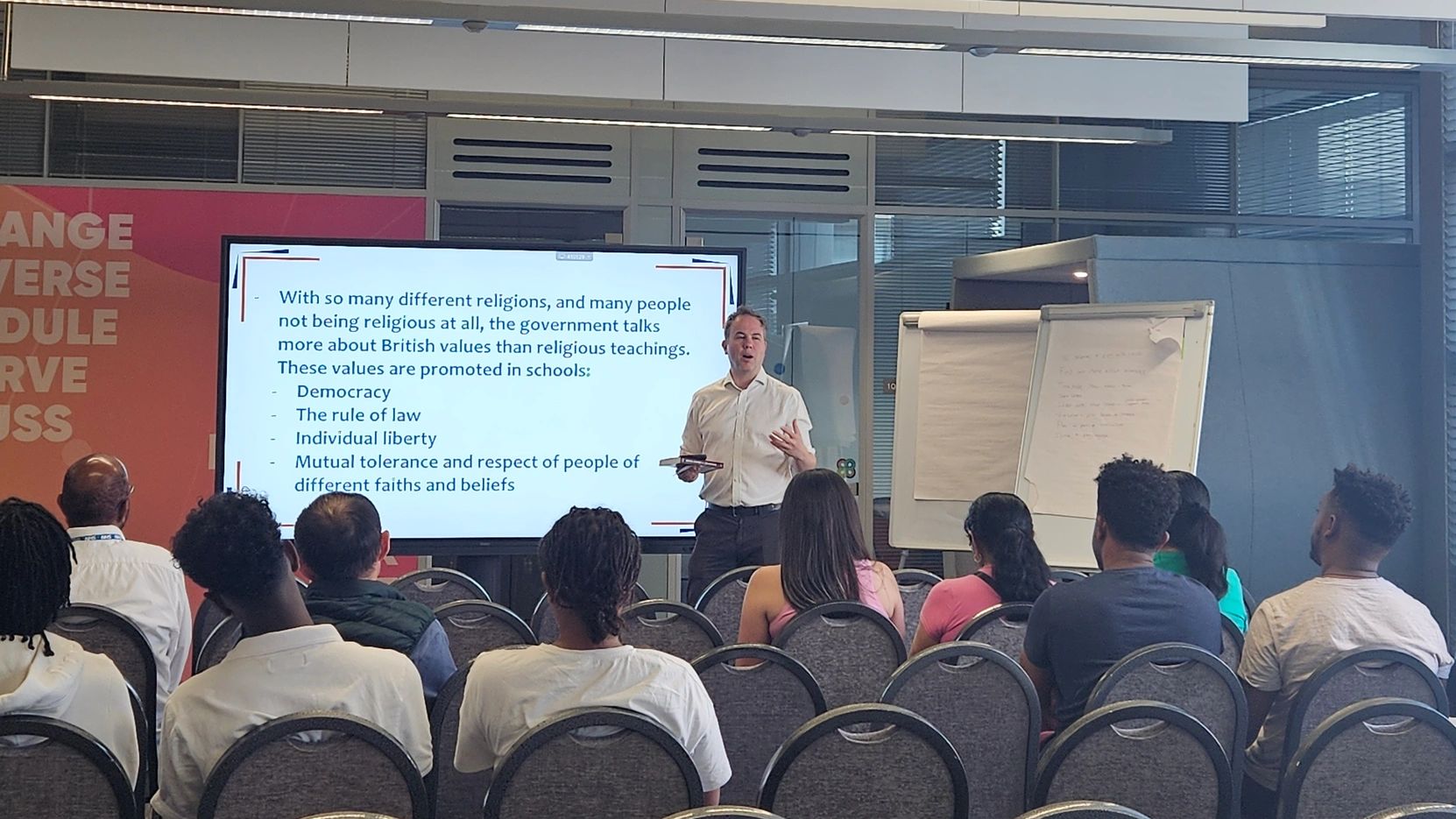 Man giving a presentation about British values to an audience.