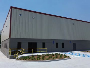 Industrial building with parking and landscaping.