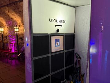 Oval enclosed photo booth and props.